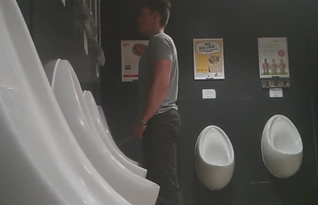 guy peeing urinal spy camera