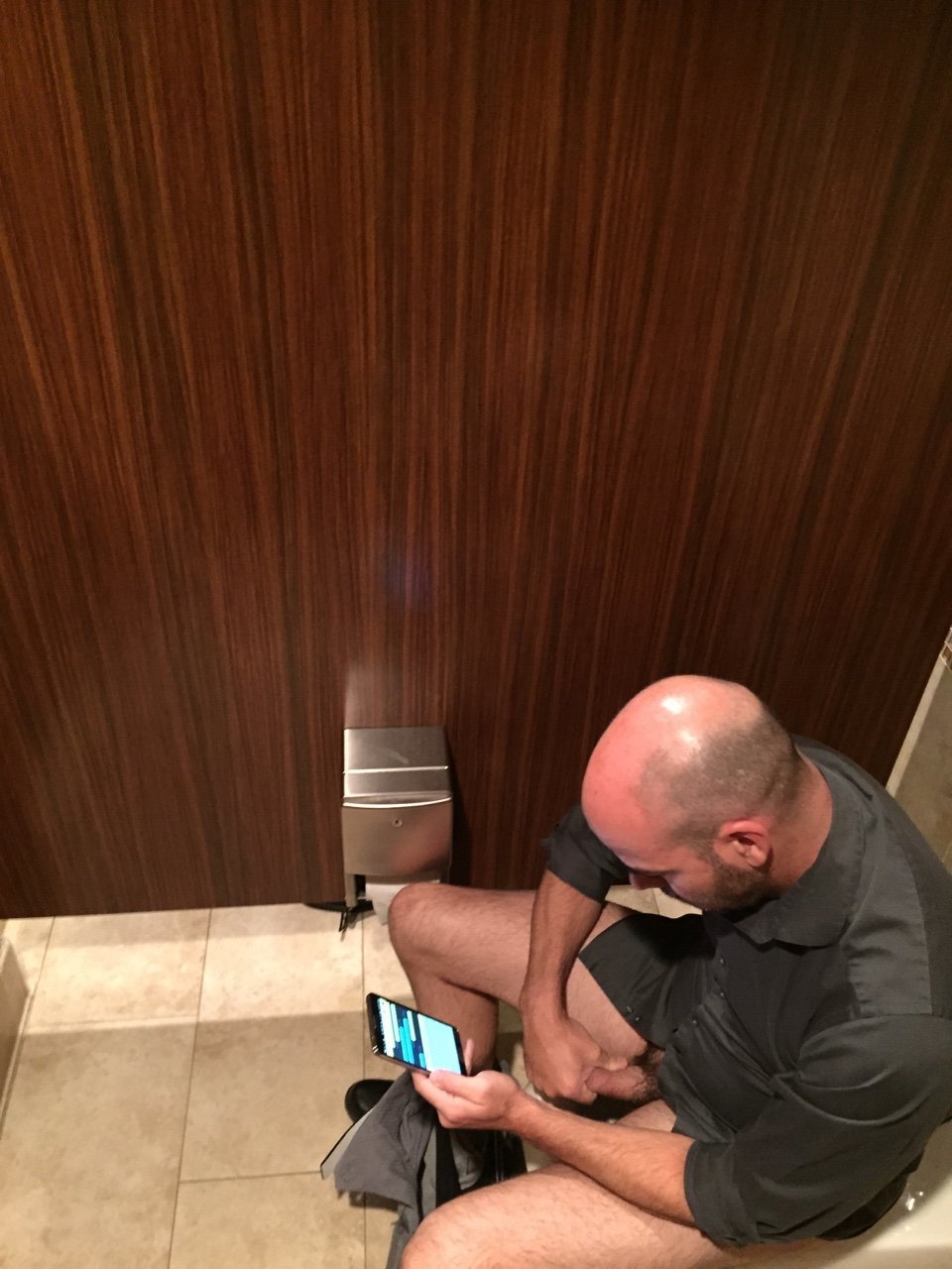 man jerking public toilet