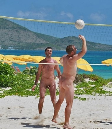 guys playing beach volley naked