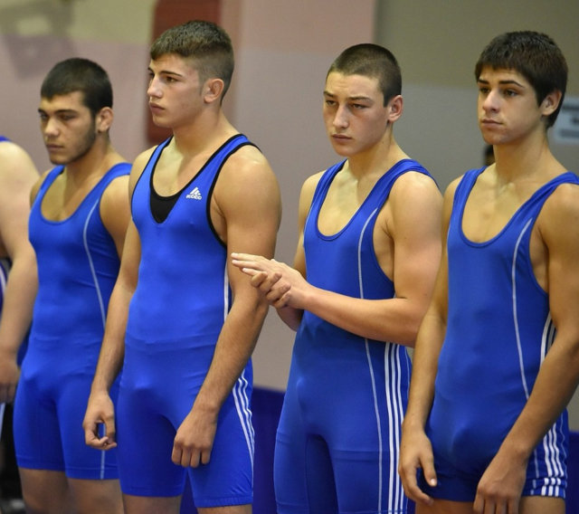 Young athletes with spandex singlets reveal their dick lines