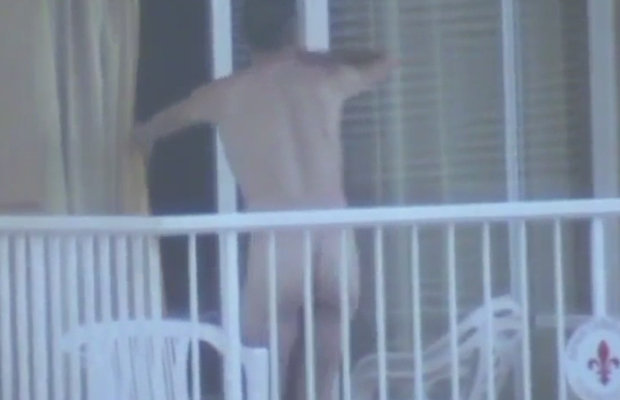 Naked guy caught on the balcony, he shows his bubble butt