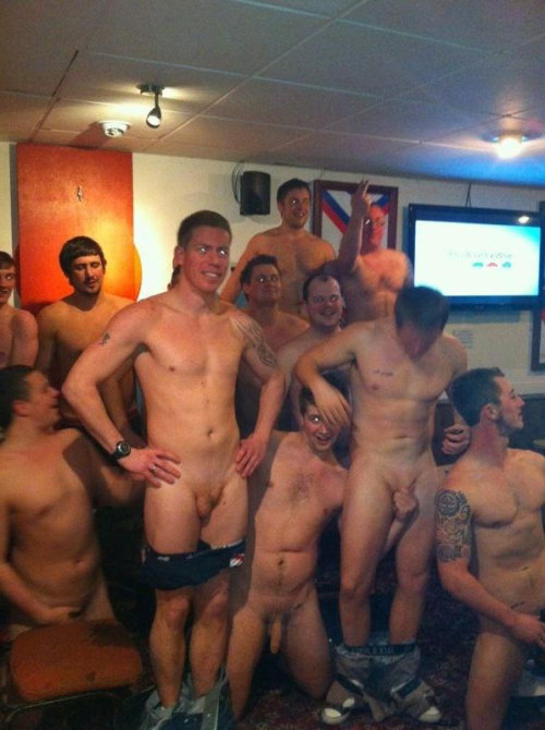 The guy in the middle holds his friend's dicks. Is him str8?