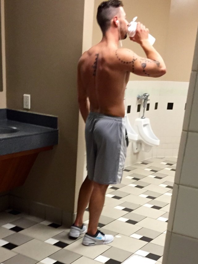 guy walking gym bathroom lycra shorts