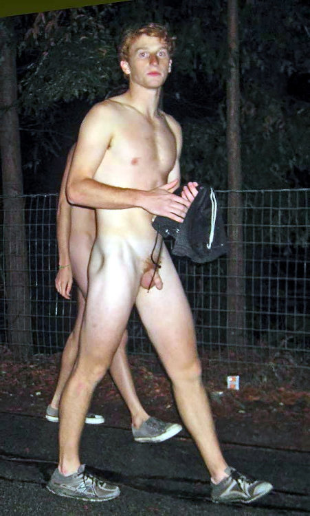 guy walking naked outdoor.