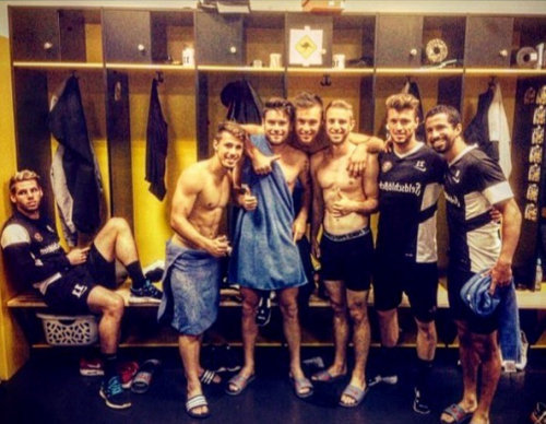 sportsmen celebrating shirtless
