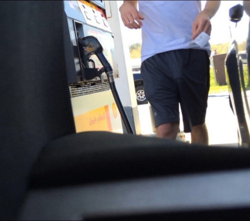 guy freeballing gas station