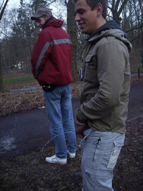 two friends caught peeing street