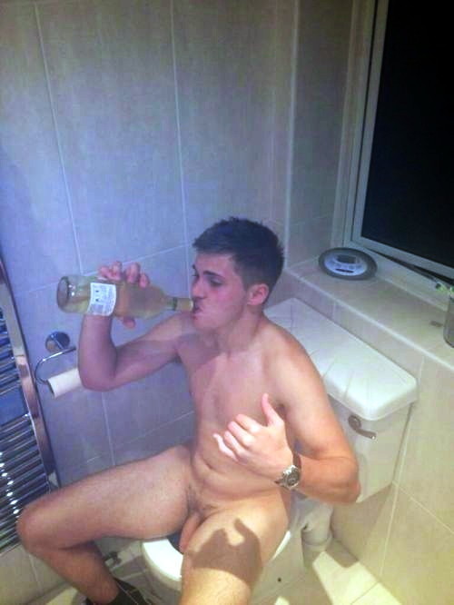 guy-drinking-wine-on-the-bowl-bathroom