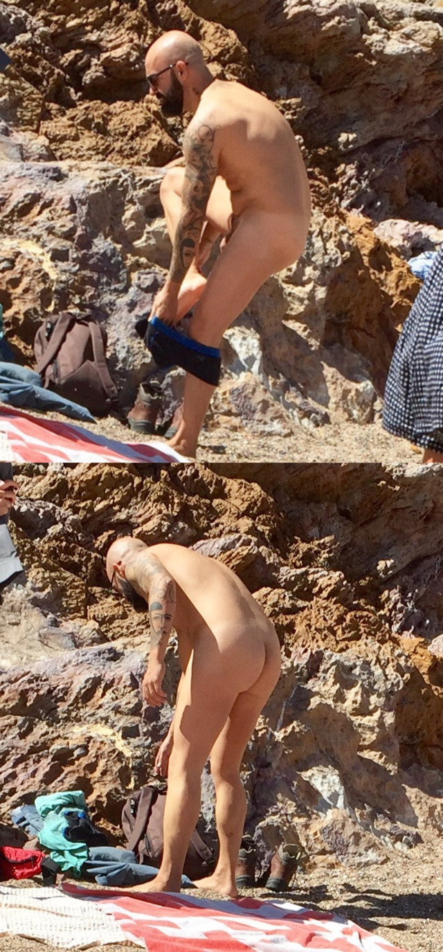 man-stripping-naked-beach