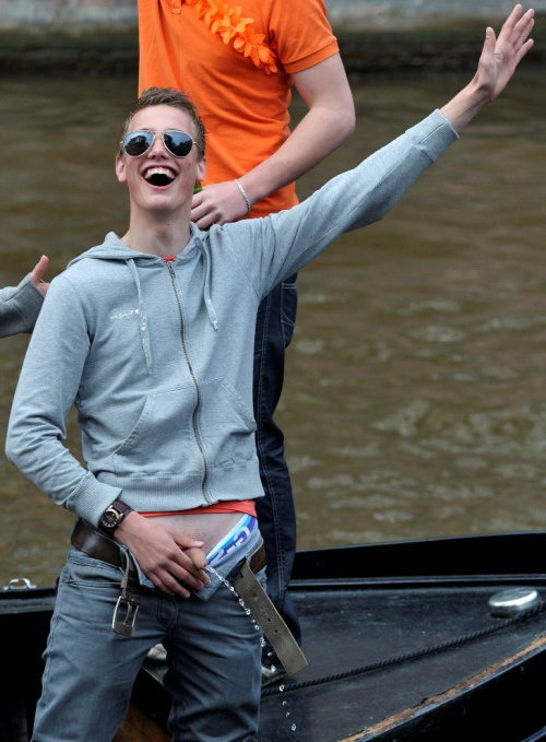 uncut-lad-peeing-from-a-boat