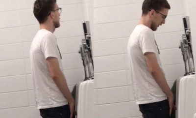 guy getting a boner while peeing at the urinal