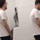 guy getting a boner while peeing at the urinal