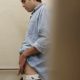 latin guy caught peeing at the urinals