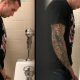tattooed guy caught peeing at urinals