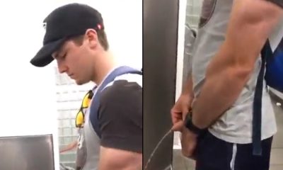 handsome guy caught peeing at urinal
