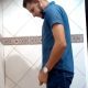 latin guy caught peeing at the urinals