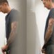 tattooed caught by spycam while peeing at urinal