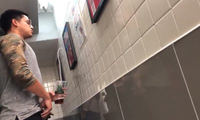 nice latin guy with uncut cock peeing at urinals