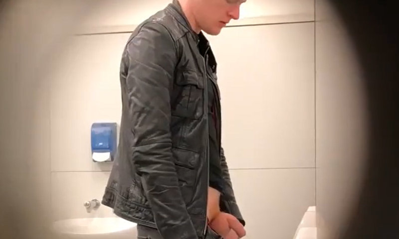 uncut guy proud to show off cock while peeing at urinals