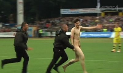 naked streaker running on the pitch