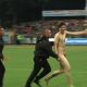 naked streaker running on the pitch