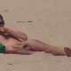 nudist guy sunbathing naked at the beach