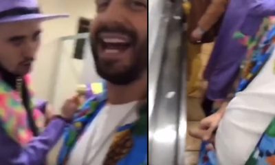 guys having fun while peeing at urinals