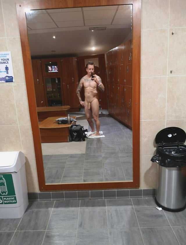 hot guy showing off in gym changing room