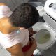 guy caught peeing from over stall in toilet