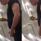 guy peeing at urinal while eating apple