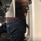 man with big cock peeing at airport urinal