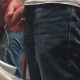 uncut guy with lot of foreskin peeing at urinal