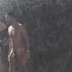 nudist man showering at the naturist beach