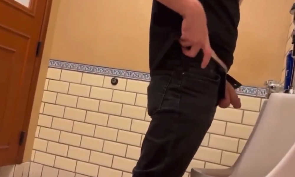 guy peeing at urinal with cock and balls out