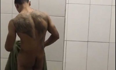 tattooed guy caught drying himself in locker room