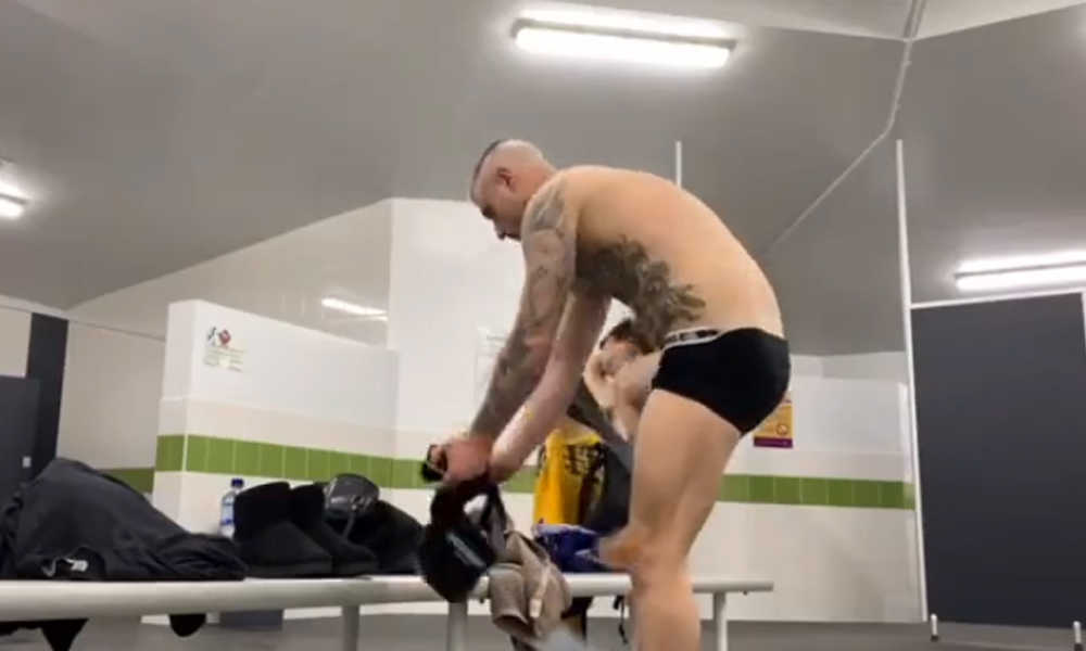 tattooed guy caught undressing in locker room