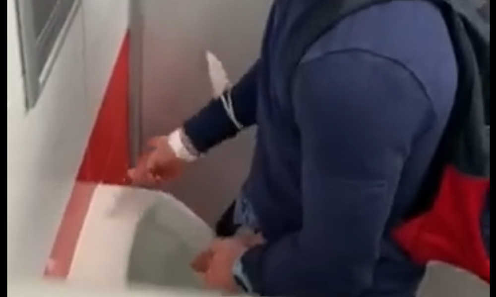 this guy reveals a huge cock at urinals