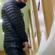 hung man caught peeing urinal