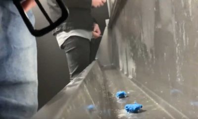 guys caught pissing at urinals