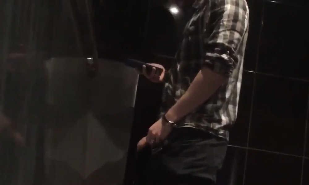 hung uncut guy peeing at club urinals