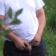 man with huge uncut cock caught peeing in the bushes