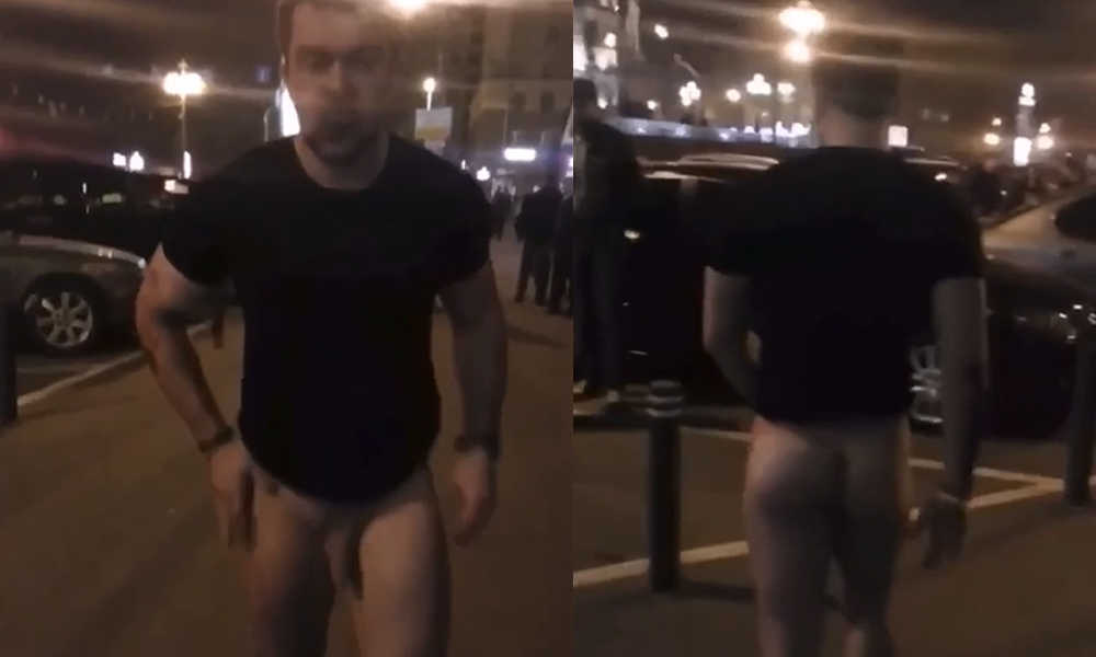 straight drunk guy naked in the street with lot of people