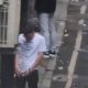 two men caught peeing in a street