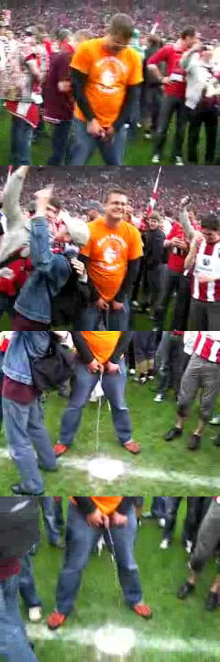 football supporter peeing on the pitch