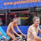 men riding bike totally naked during WNBR