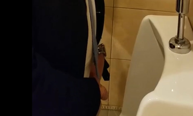 man in suit with uncut dick caught peeing at urinal