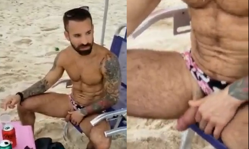 uncut guy pissing at the beach