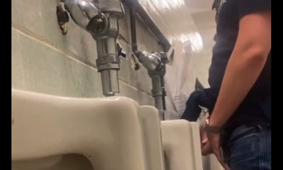 handsome lad caught by hidden camera while peeing at a urinal