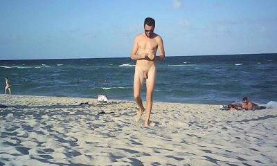 nudist guy walking on the beach captured by spycam