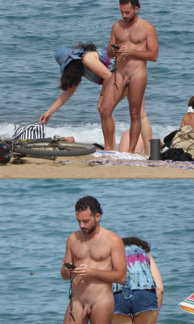 straight nudist guy captured naked on the beach while texting with his phone